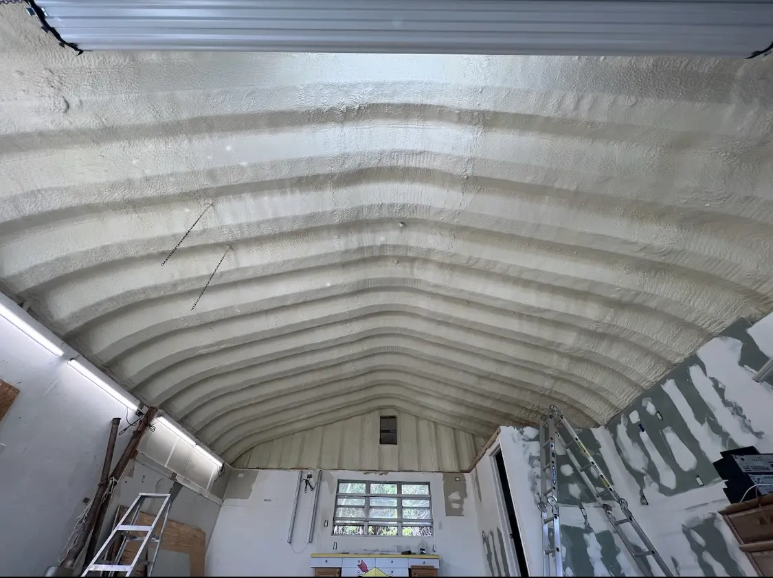Spray polyurethane foam applied to the underside of a metal roof deck in Forest Park